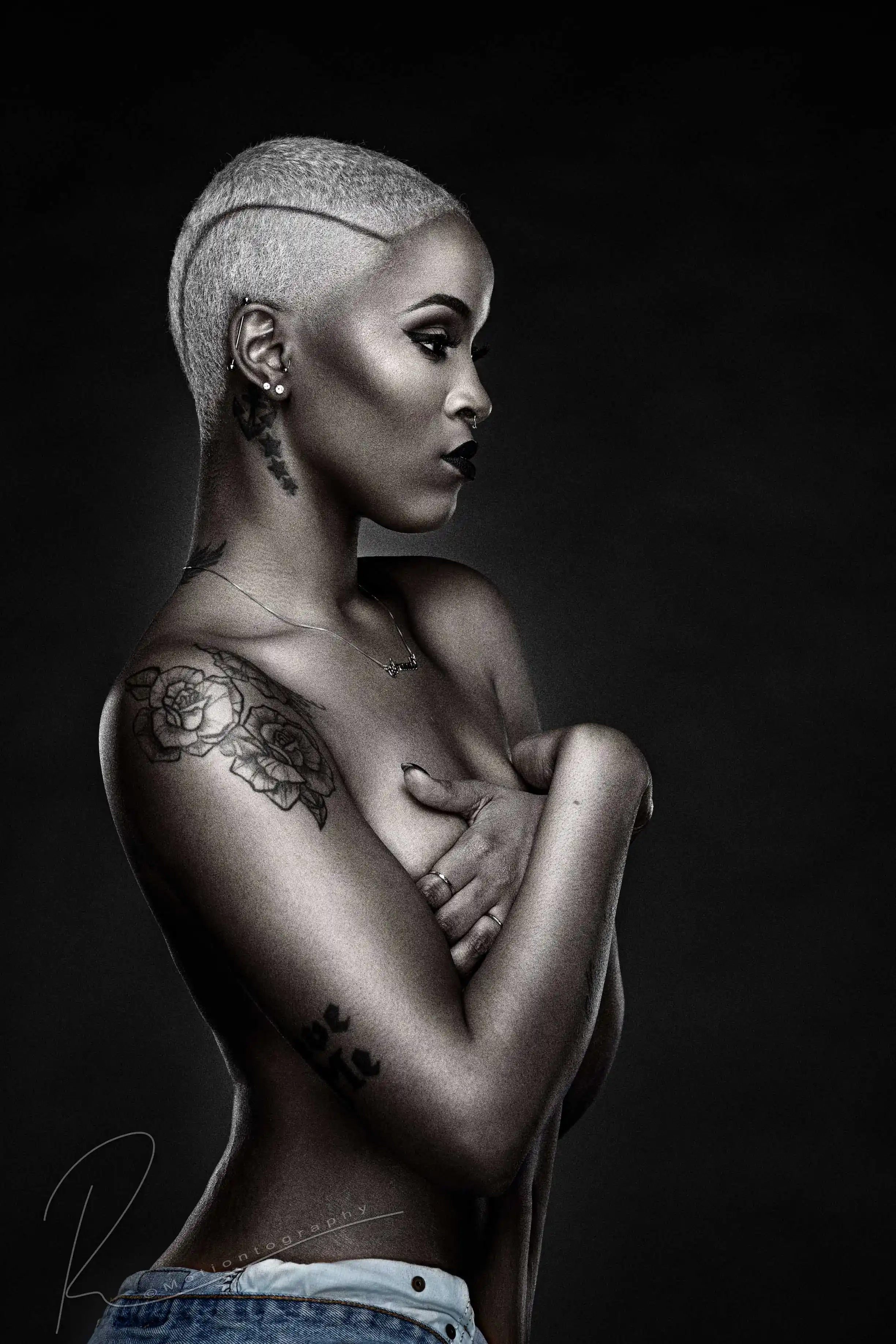 Empowered boudoir portrait of woman with short hair