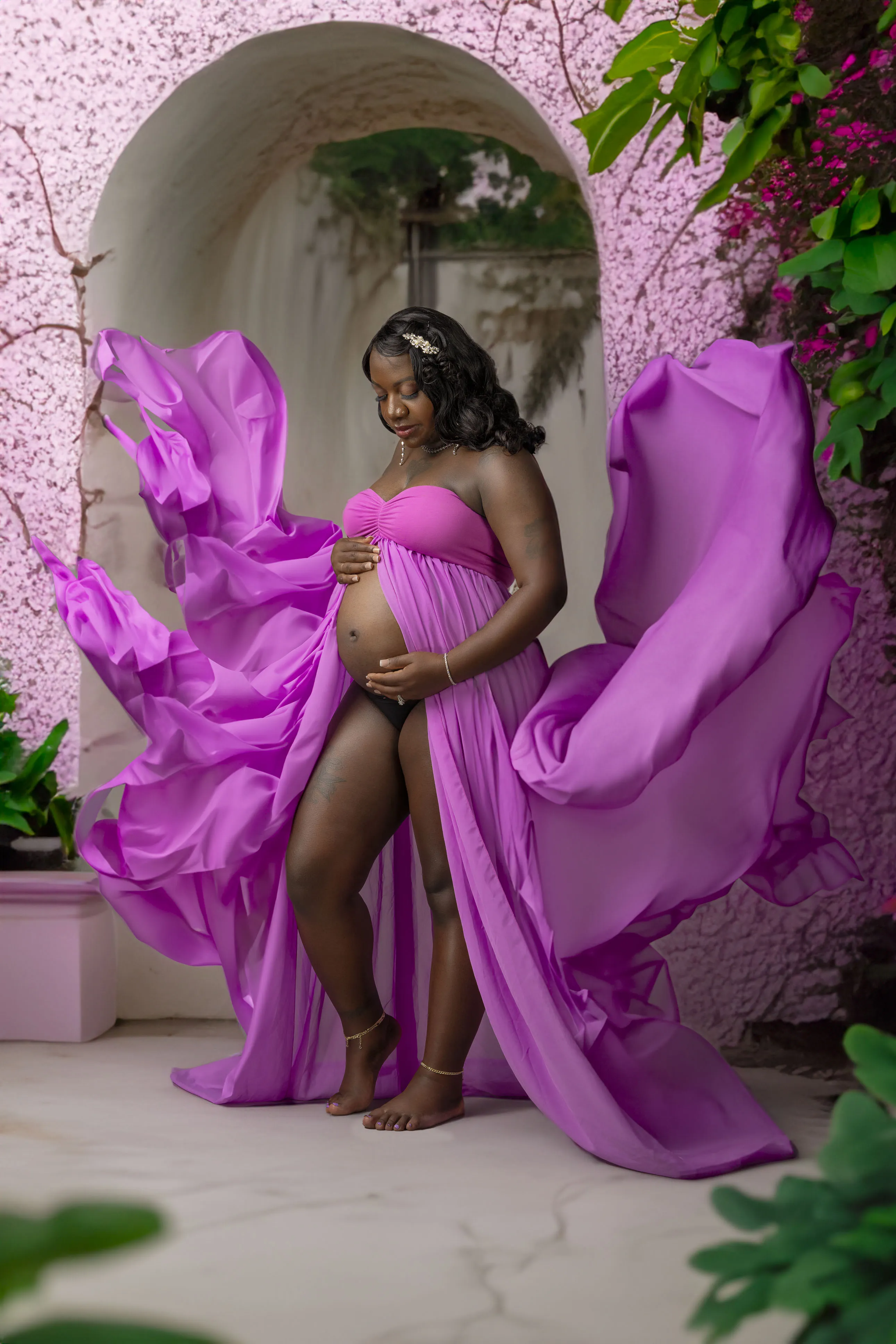 Studio maternity photo magenta gown floral archway Suffolk VA