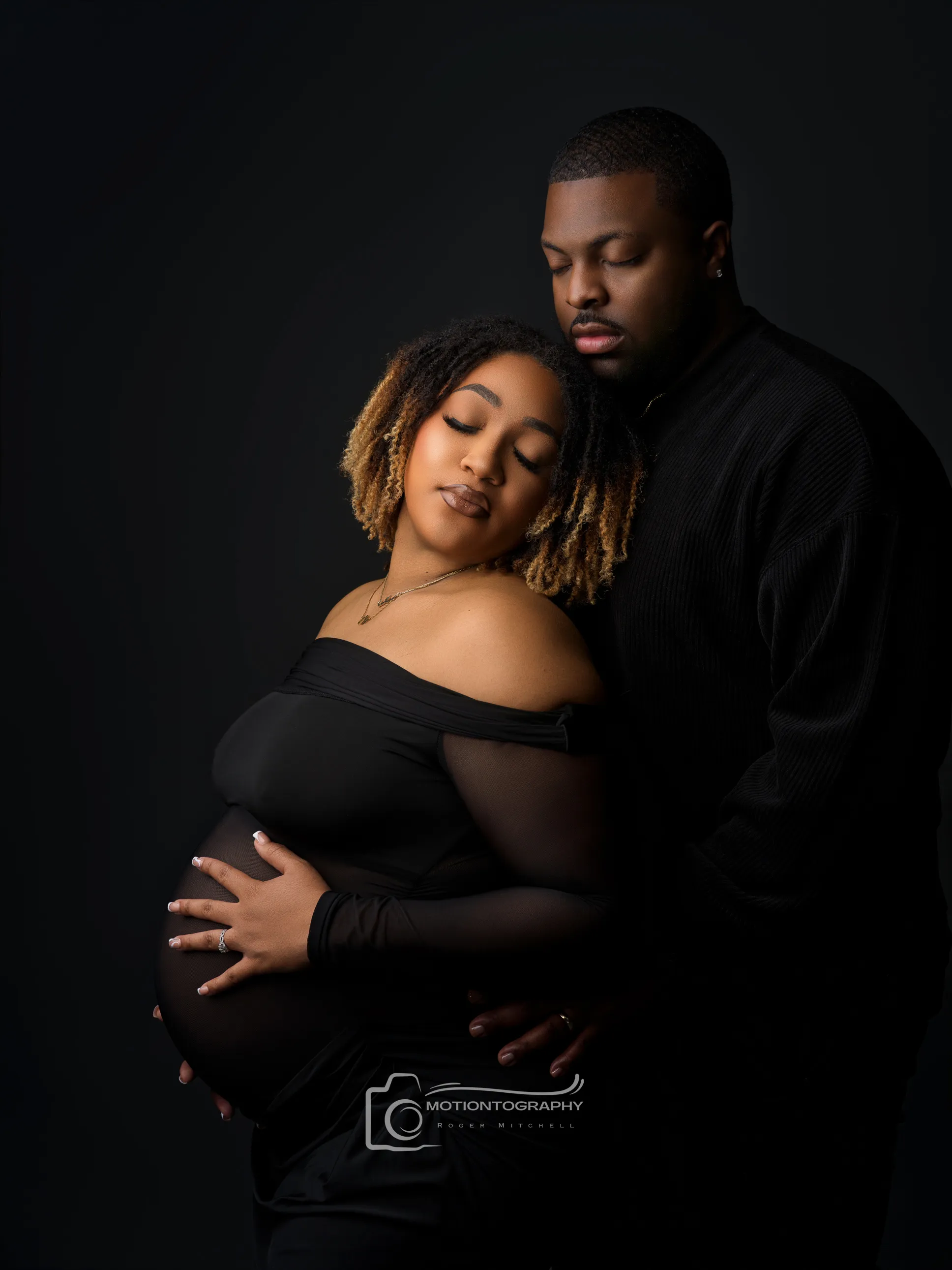 Close-up fine art maternity portrait couple embracing baby bump Norfolk