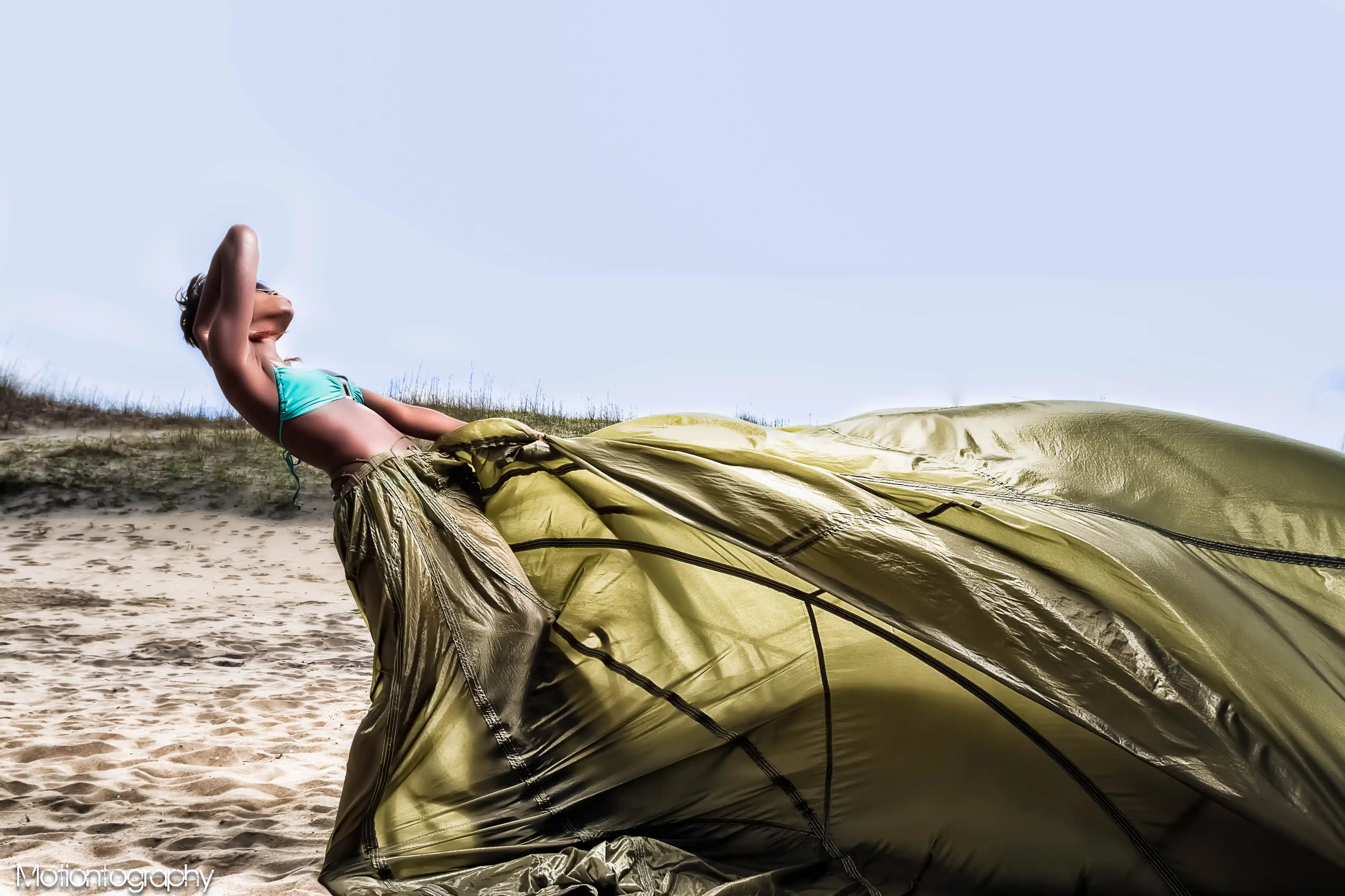 On location beach fashion photo green parachute dress bikini
