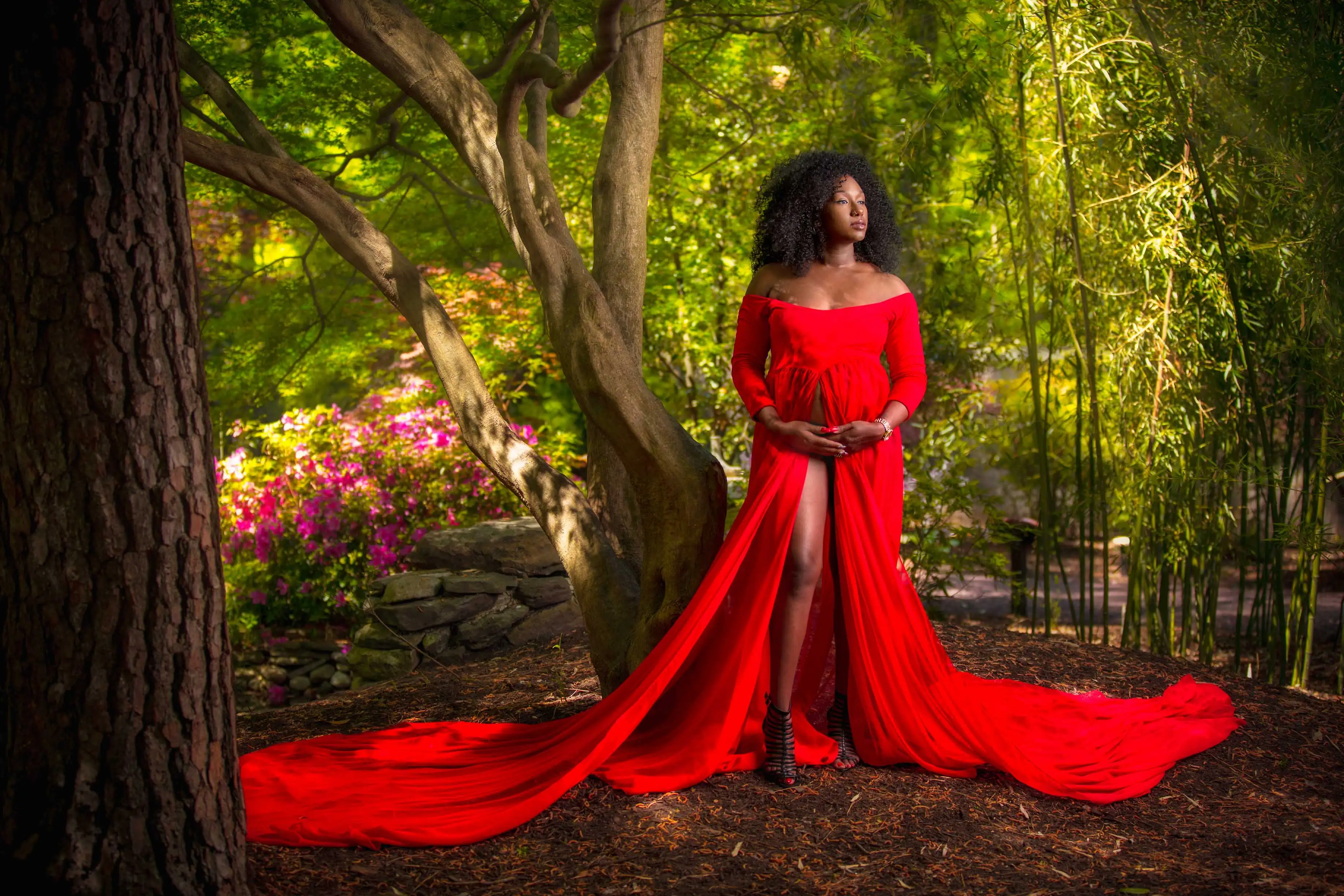On location forest maternity photo pregnant woman red dress
