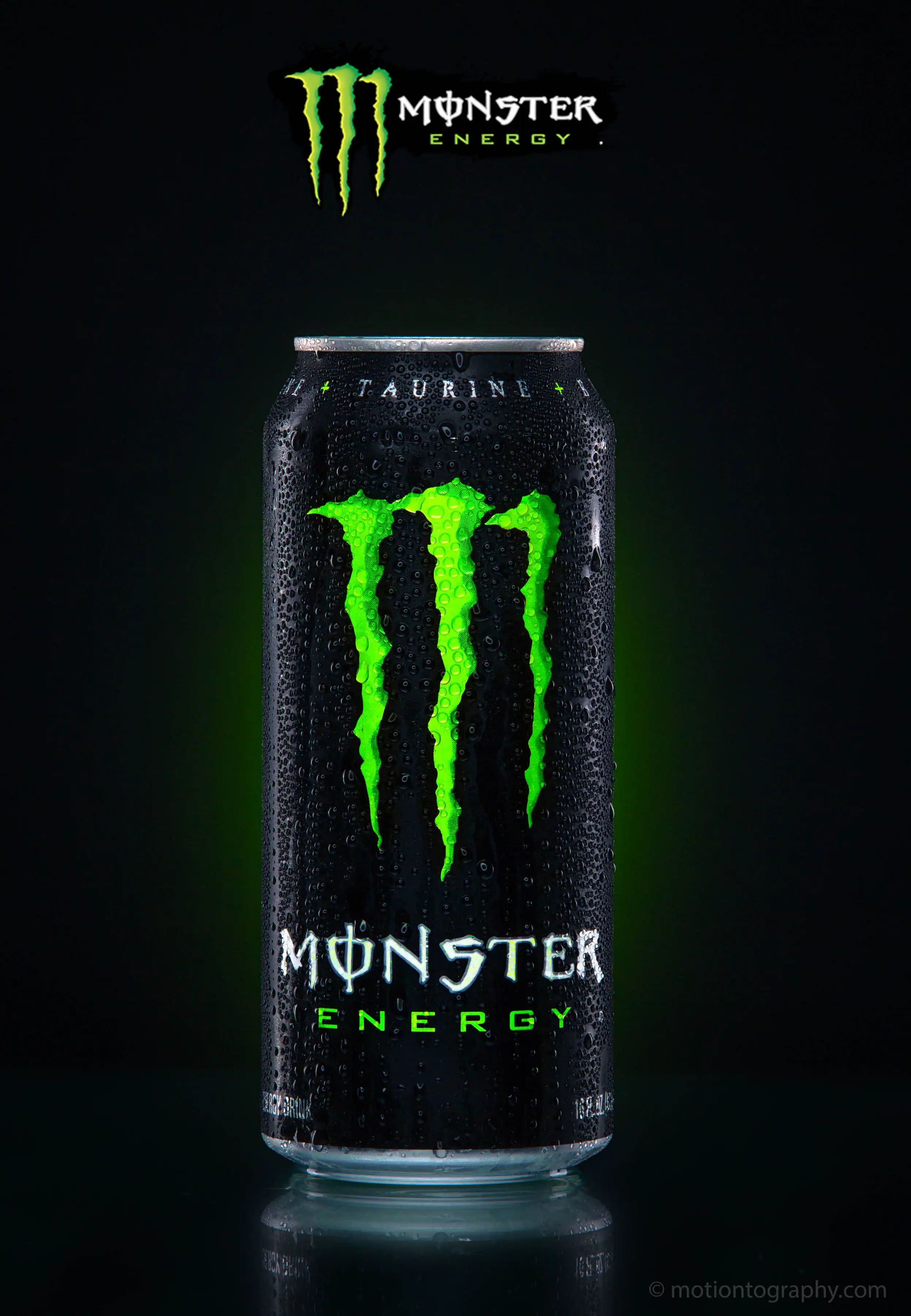 Close-up of a Monster Energy drink can with water droplets and logo